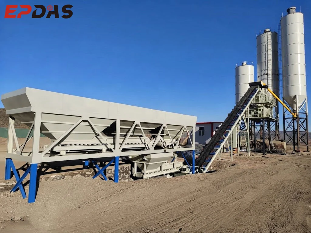 Stationary concrete batching plant with aggregate bins, conveyor and silos