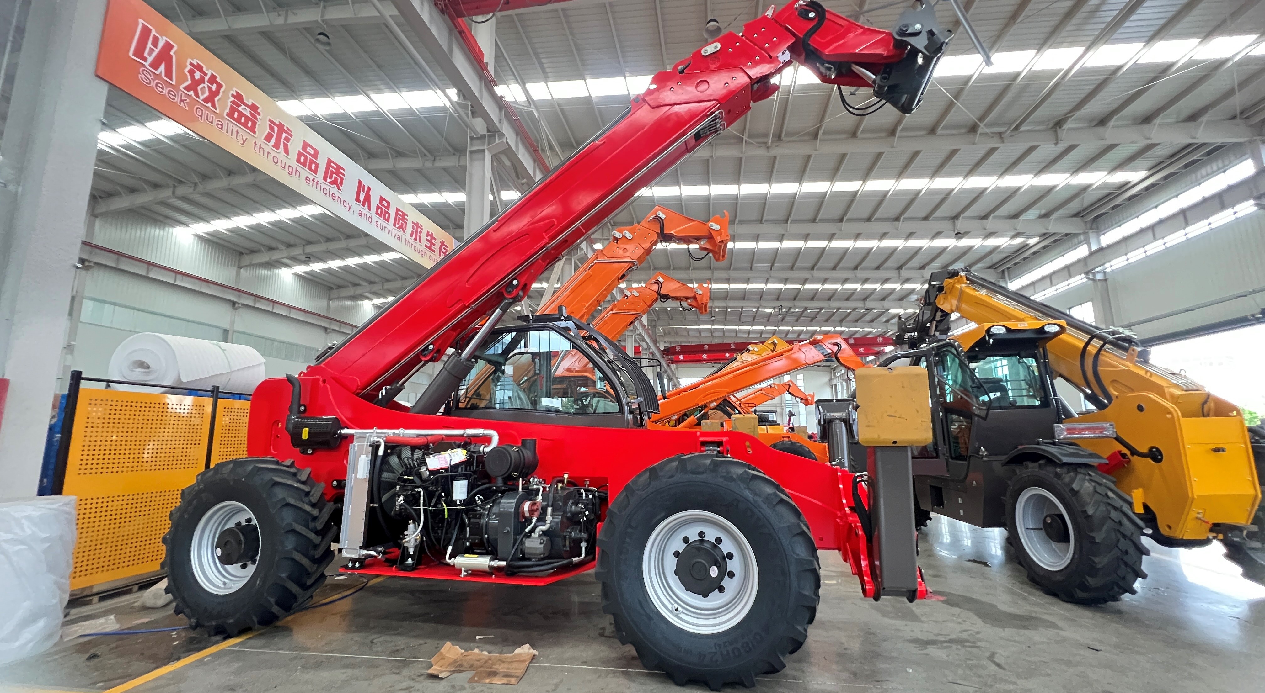 EPDAS telehandlers photographed inside an equipment workshop