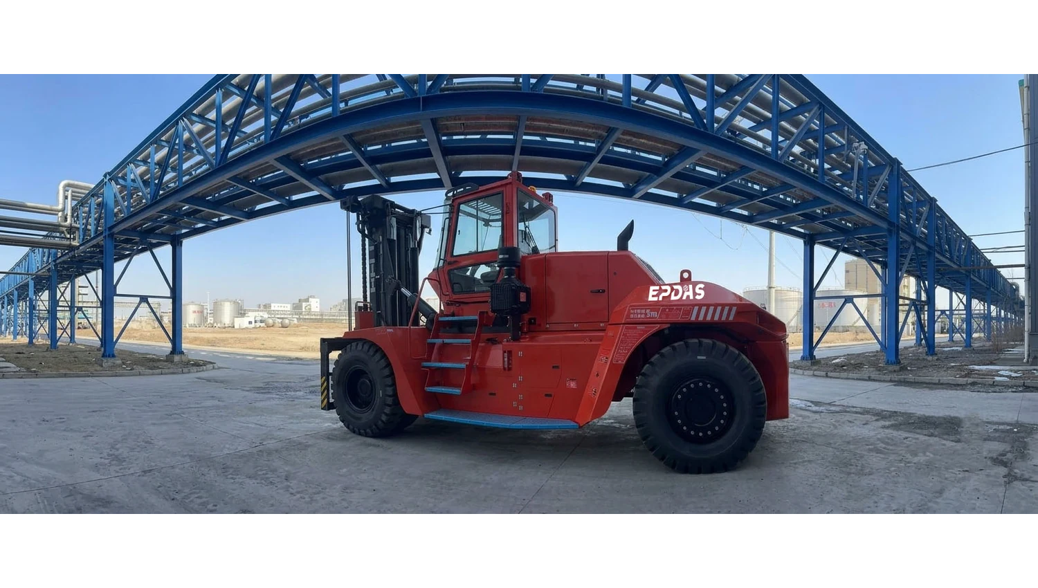 Red forklift photographed at an industrial site